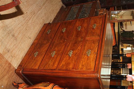 Round cornered walnut chest of drawers